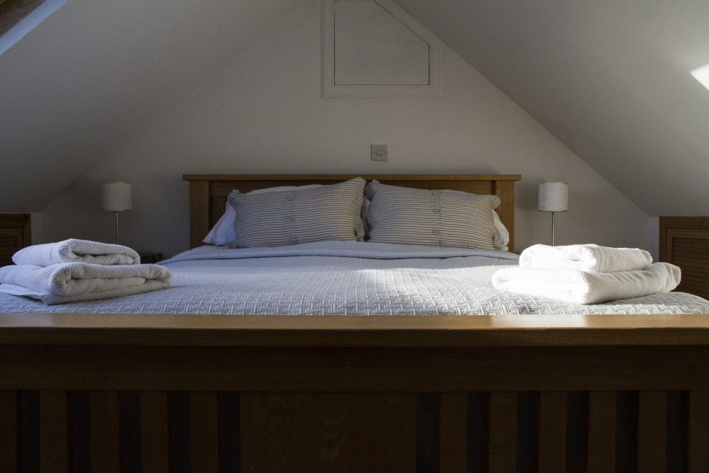 beautiful bedroom shot, showing luxury linens and attention to detail